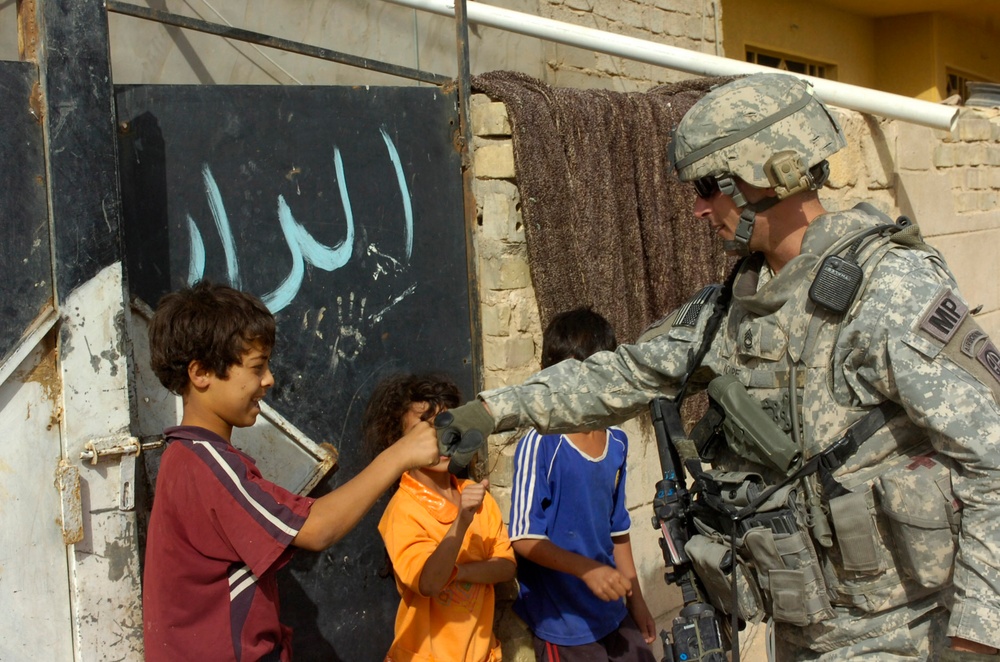 Military Police paratroopers patrol along main Baghdad highway
