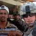 Military Police paratroopers patrol along main Baghdad highway