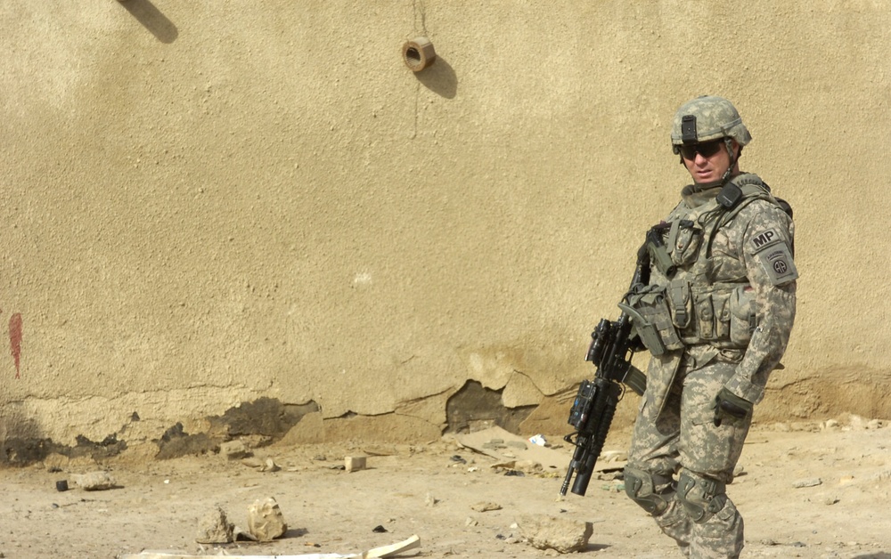 Military Police paratroopers patrol along main Baghdad highway
