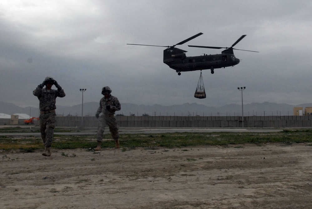 Soldier's load supplies for Afghan forward operating bases