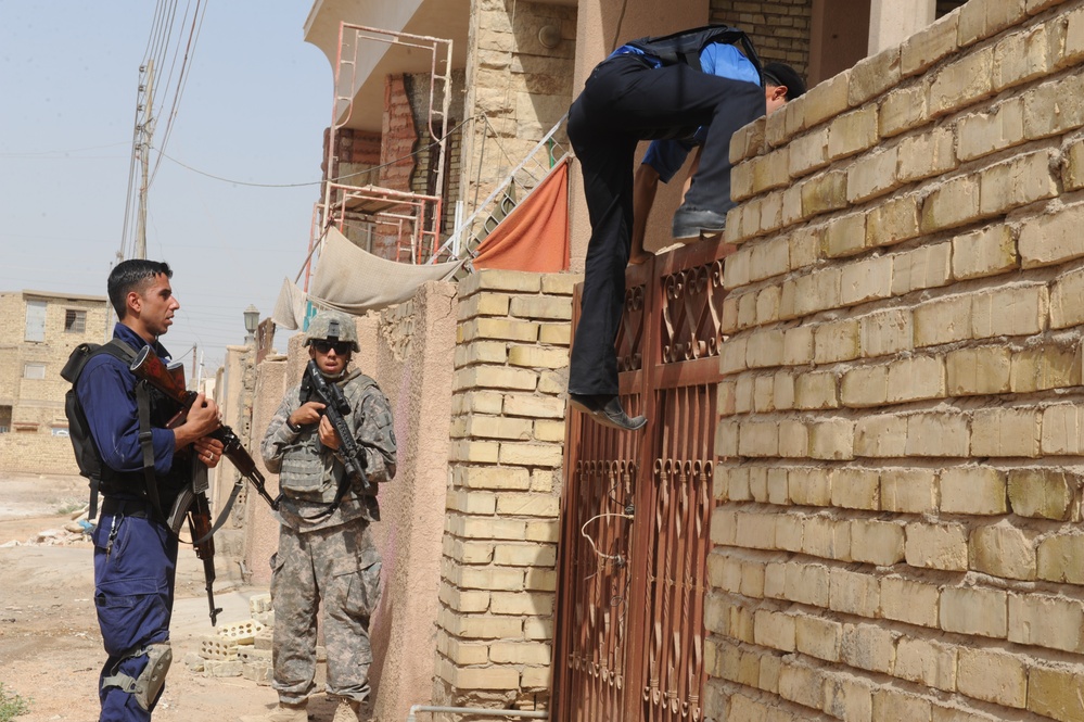 Iraqi police patrol south Baghdad