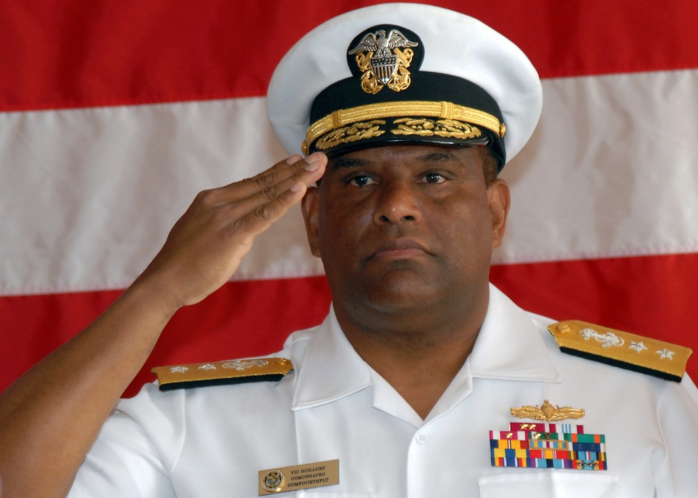 Rear Adm. Victor G. Guillory takes command