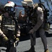 Explosive ordnance disposal fast ropes into action