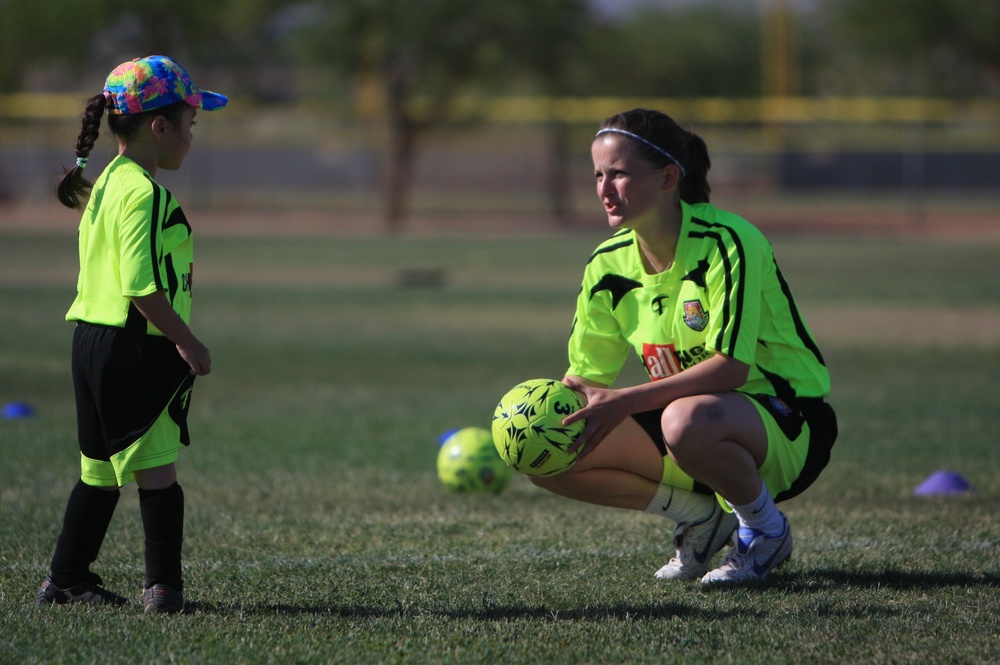 British Soccer Camp coaches show Combat Center children skills, sportsmanship