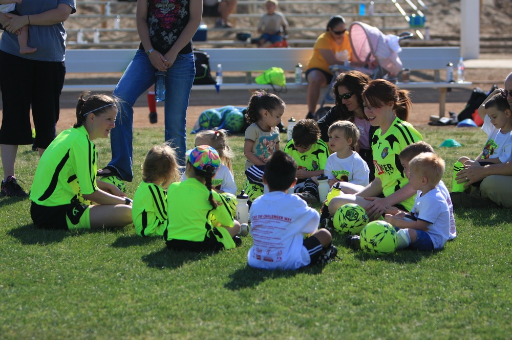 British Soccer Camp coaches show Combat Center children skills, sportsmanship