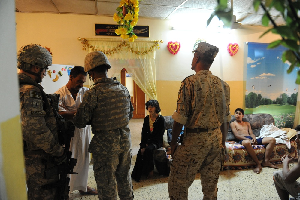 Iraqi forces search for improvised explosive device making materials