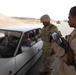 U.S. Soldiers Assist Iraqis at Checkpoints