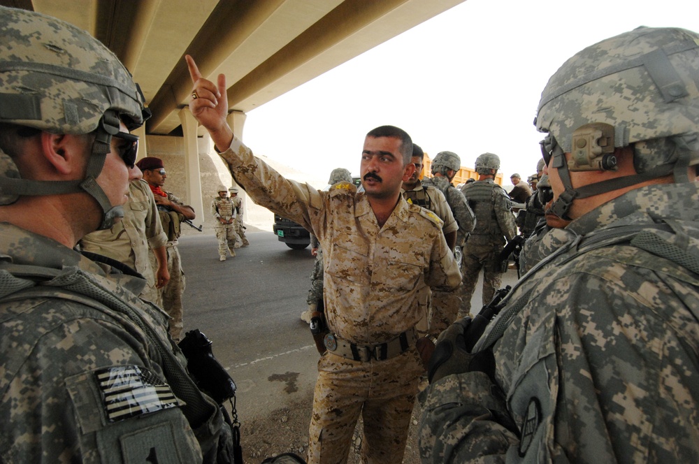 U.S. Soldiers Assist Iraqis at Checkpoints