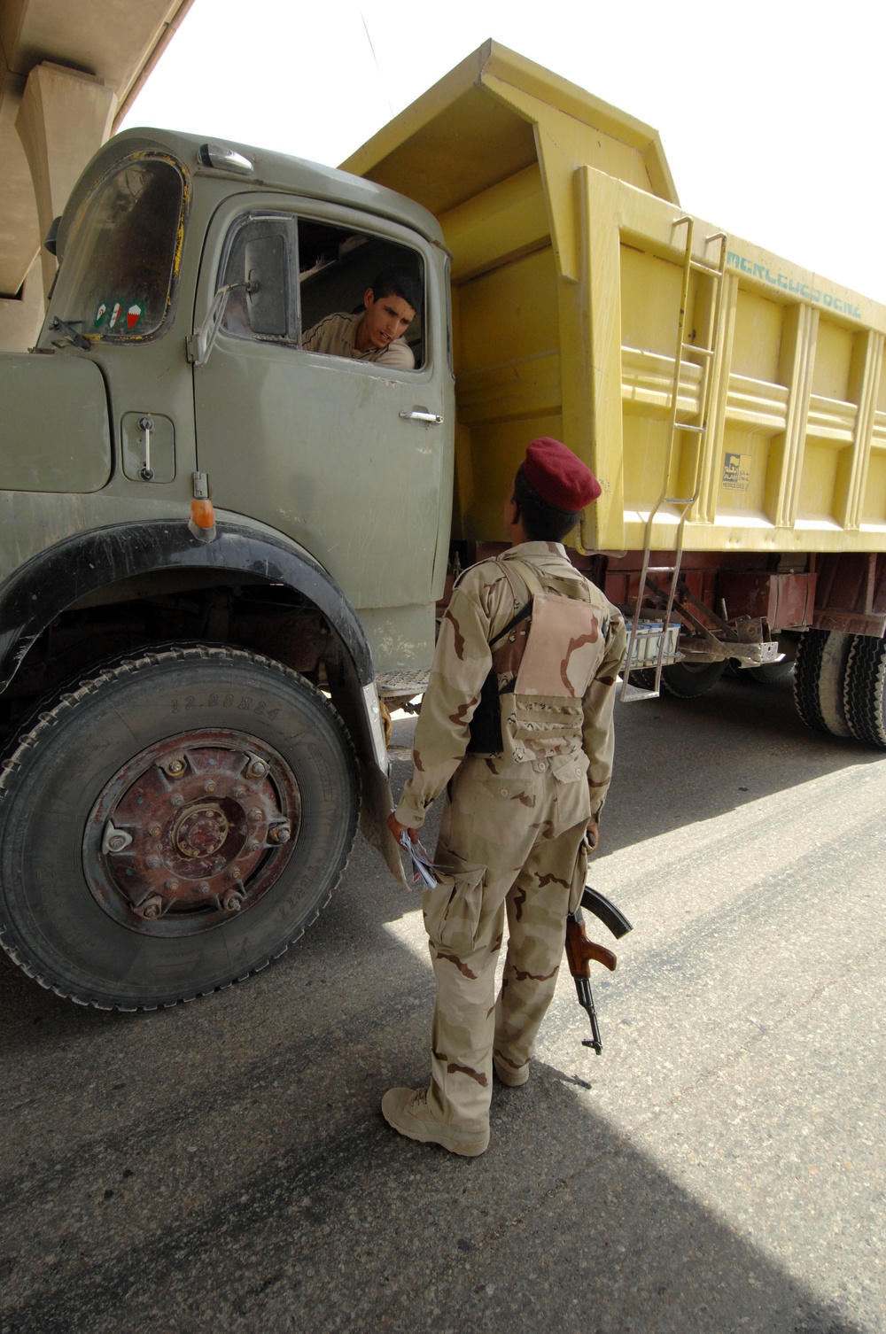 U.S. Soldiers Assist Iraqis at Checkpoints