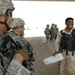 U.S. Soldiers Assist Iraqis at Checkpoints