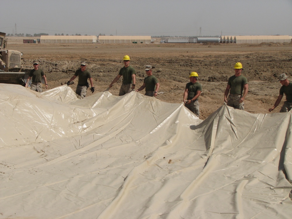 Marines prepare fuel bladder at Camp Ramadi