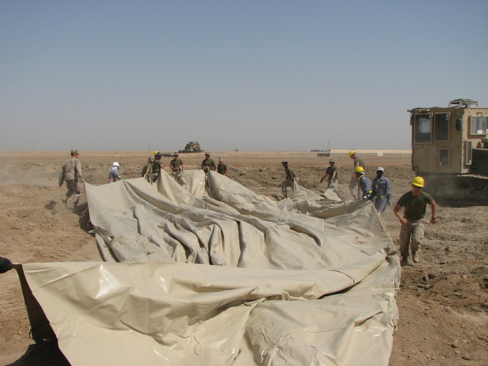 Marines prepare fuel bladder at Camp Ramadi