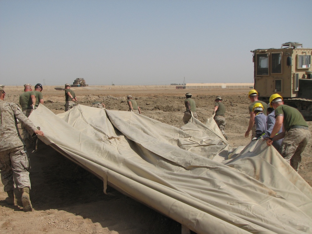 Marines prepare fuel bladder at Camp Ramadi