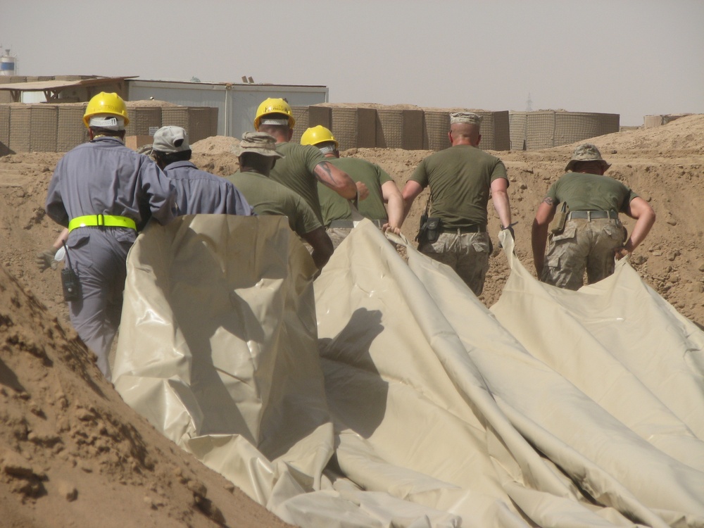 Marines prepare fuel bladder at Camp Ramadi