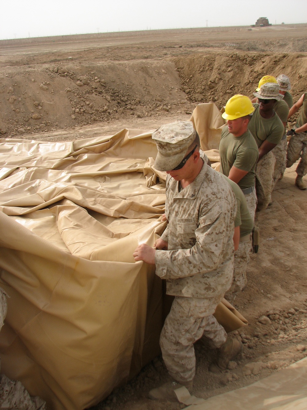 Marines prepare fuel bladder at Camp Ramadi