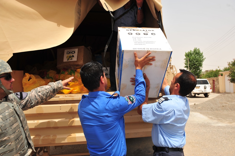 Soldiers Hand Out School Supplies