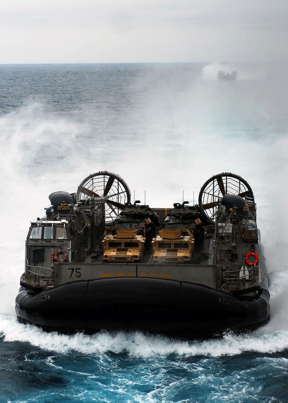 Landing craft steam from USS Bonhomme Richard