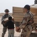 Soldiers Distribute Water and Food