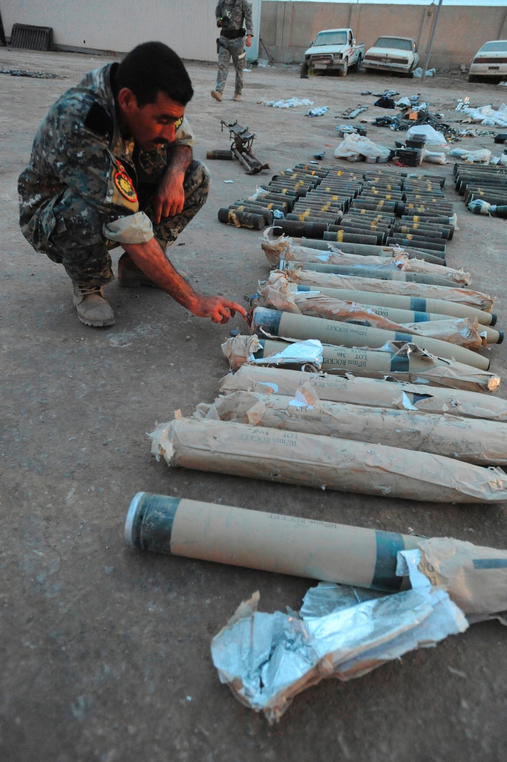 Soldiers Examine Weapons Cache