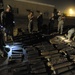 Soldiers Examine Weapons Cache