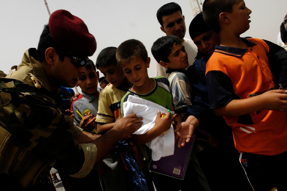 Iraqi Soldiers Distribute 5,000 Lbs. of Food and Supplies