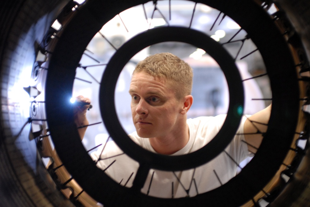 Sailor inspects jet engine