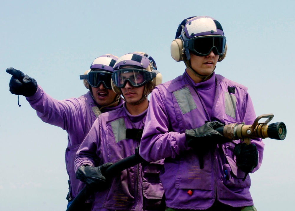 Sailors aboard USS Cleveland flight deck