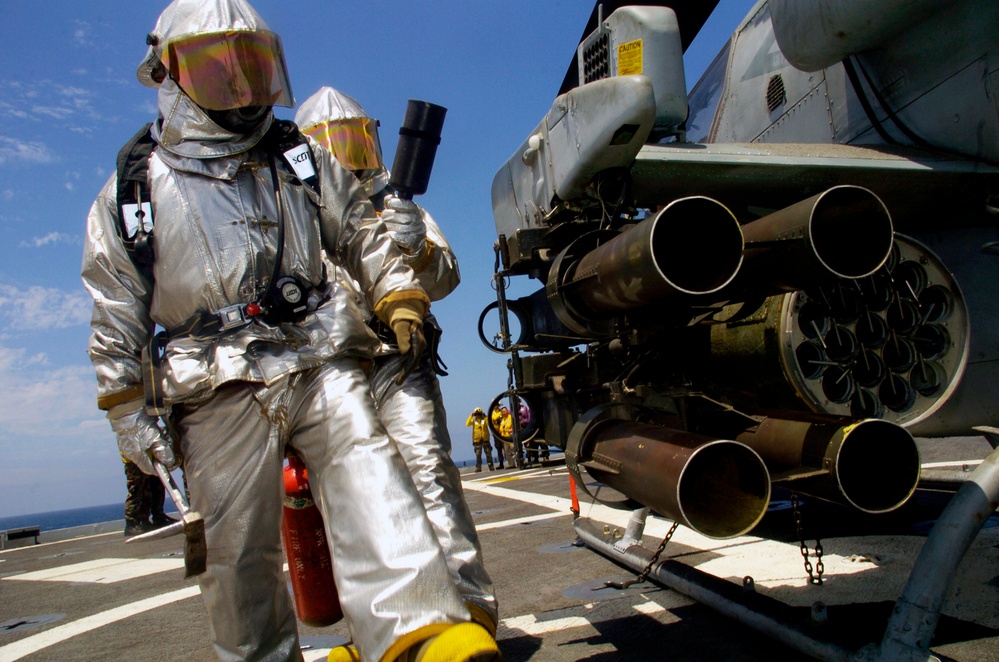 Sailors aboard USS Cleveland flight deck