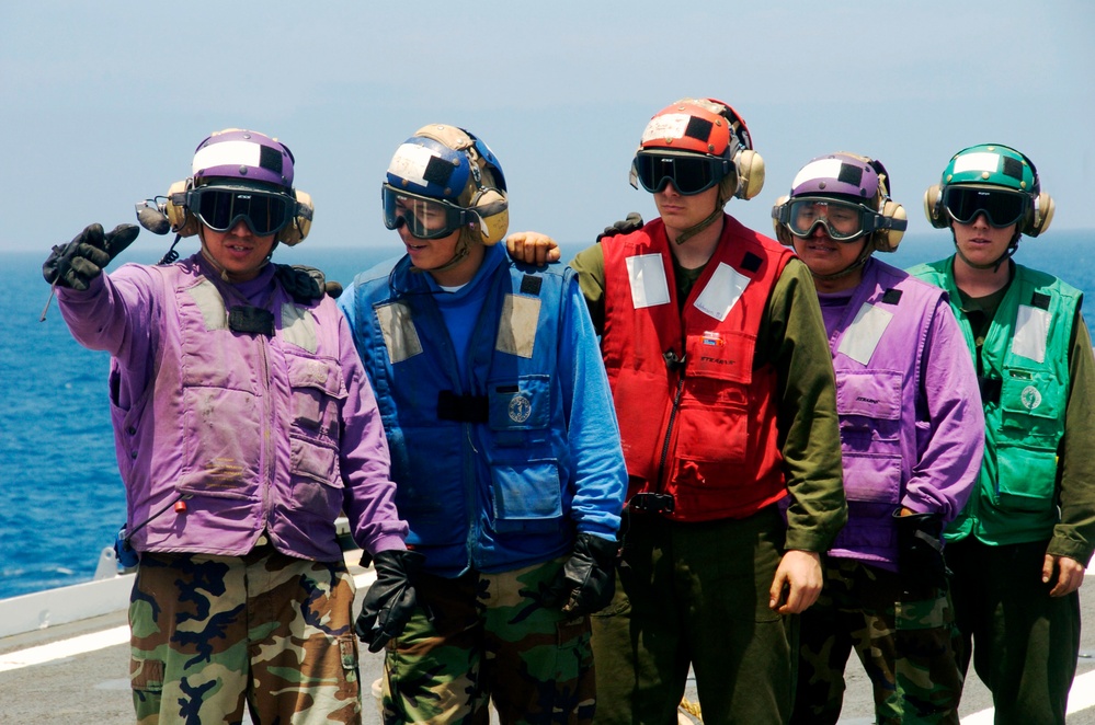 Sailors aboard USS Cleveland flight deck