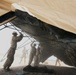 Marines build tents in Afghan firebase