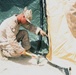 Marines build tents in Afghan firebase