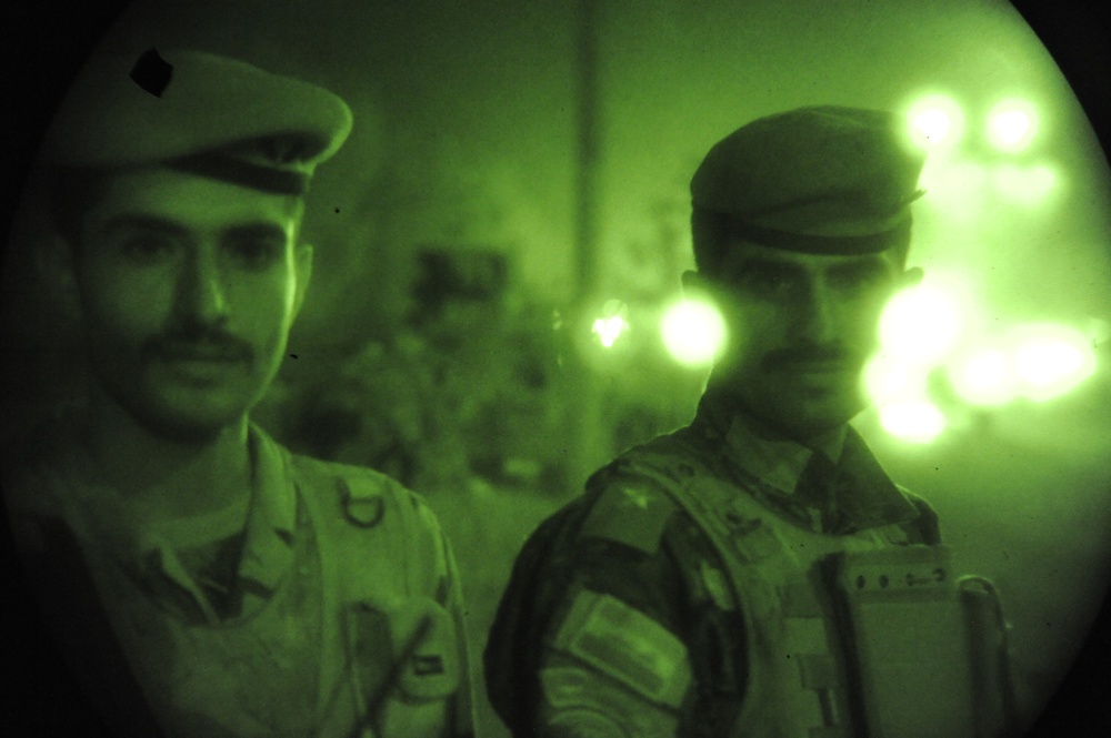 U.S. Soldiers stay in Background