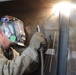 Kuwait-deployed service members dig and weld