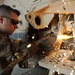 Kuwait-deployed service members dig and weld