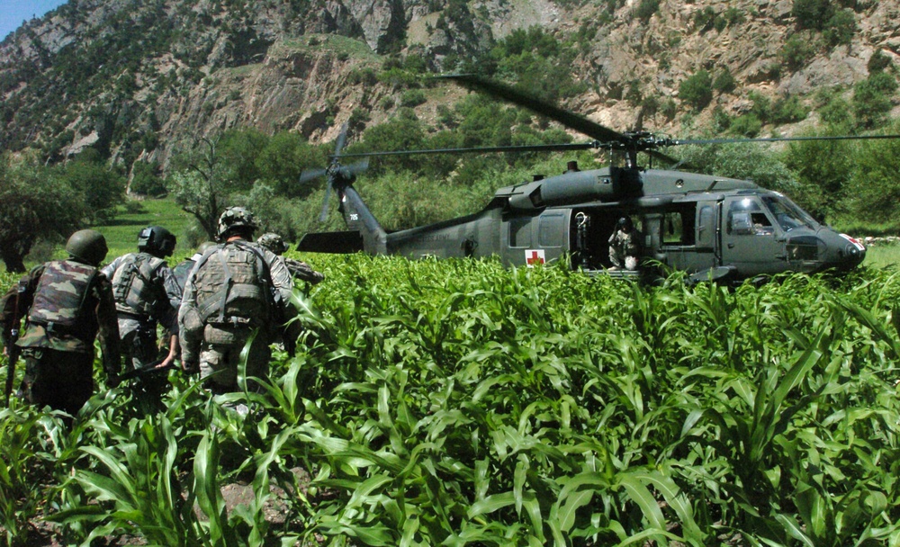 U.S., Afghan forces medically assist wounded insurgent