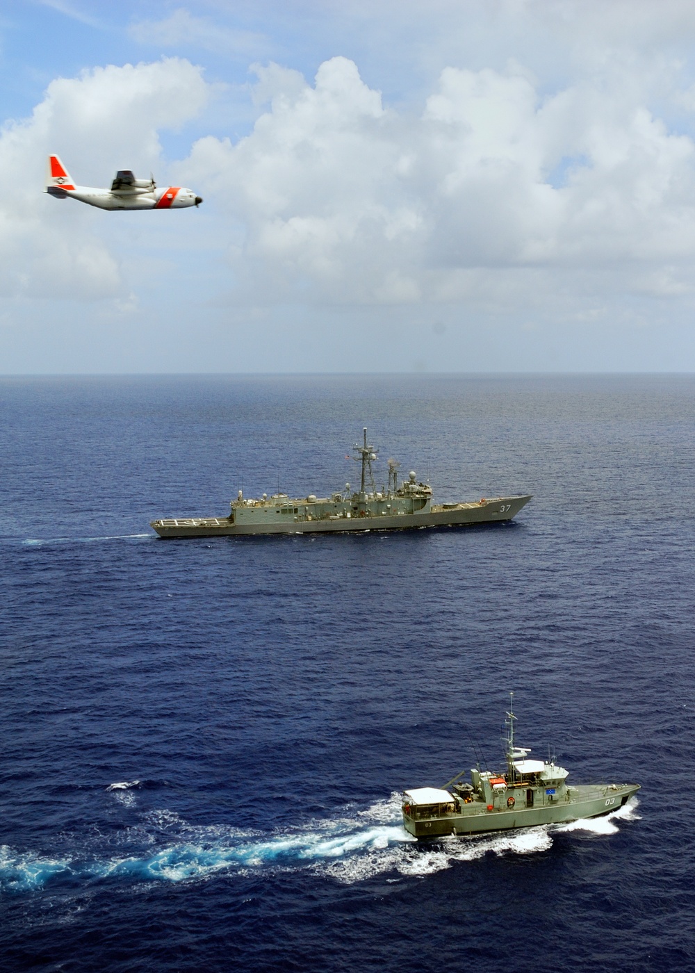 Coast Guard aircraft fly over U.S., Micronesian ships