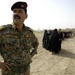 U.S., Iraqi Soldiers Hand Out Food