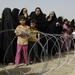 U.S., Iraqi soldiers hand out food