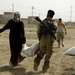 U.S., Iraqi soldiers hand out food