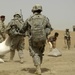 U.S., Iraqi soldiers hand out food