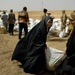 U.S., Iraqi soldiers hand out food