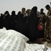 U.S., Iraqi soldiers hand out food