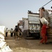 U.S., Iraqi soldiers hand out food