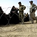 U.S., Iraqi soldiers hand out food