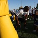 Former Super Bowl champion teaches football to Combat Center kids