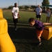 Former Super Bowl champion teaches football to Combat Center kids