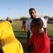 Former Super Bowl champion teaches football to Combat Center kids