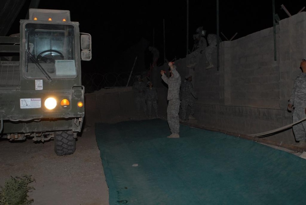 Engineers protect Soldiers by emplacing force protection screen