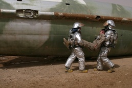 Marines and civilians train for plane crashes in western Iraq