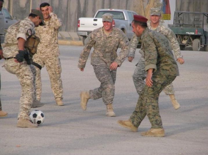 Iraqi, U.S. Soldiers pass the ball and pass some time
